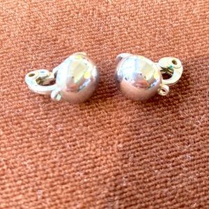 Monet signed small dome clip earrings. Bright shiny chrome. Also marked Patd